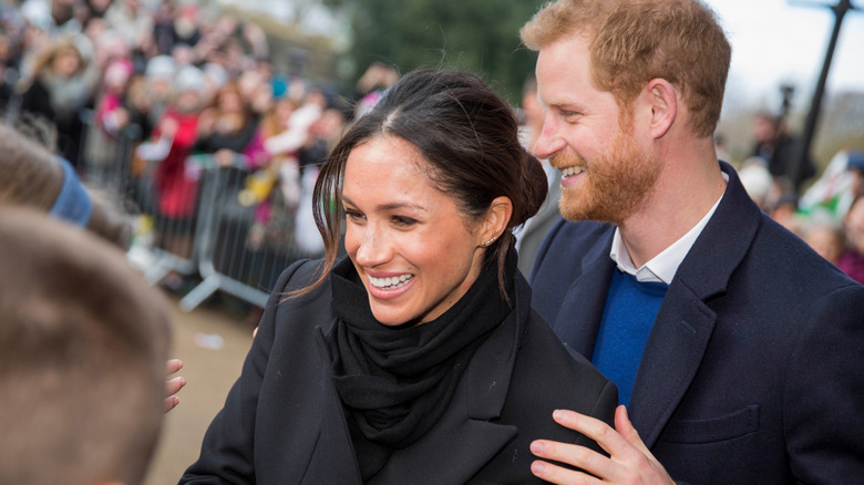 Prince Harry and Meghan Markle greeting fans