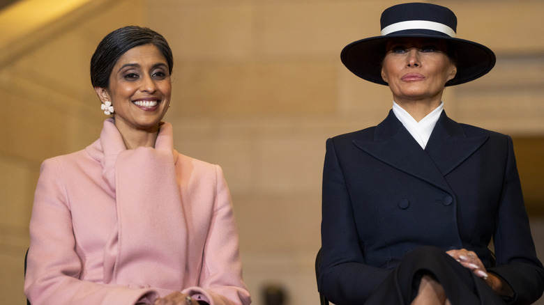 Usha Vance and Melania Trump sitting next to one another in contrasting outfits at Donald Trump's presidential inauguration