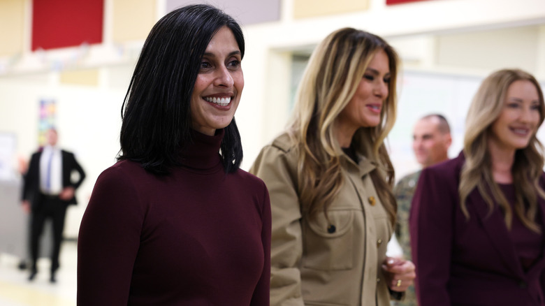 Usha Vance and Melania Trump visiting Lejeune High School while wearing contrasting outfits