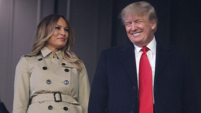 Melania Trump in a camel coat with Donald Trump in a suit