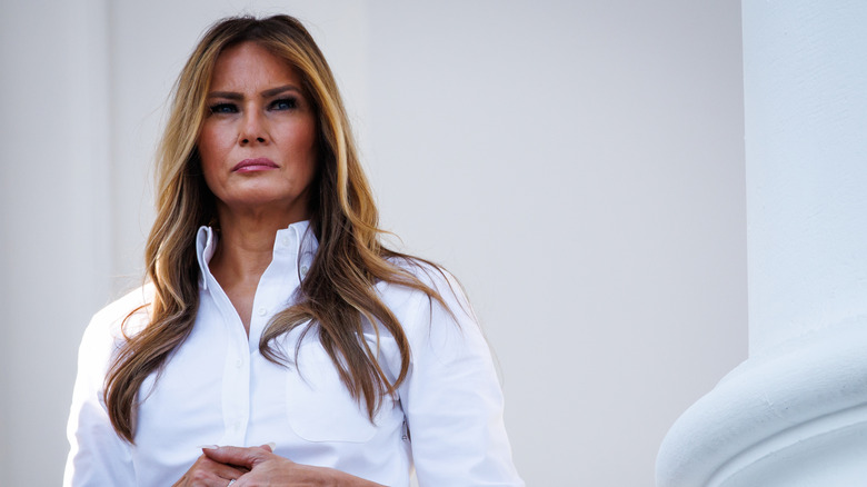 Melania Trump at the White House looking miserable in a white blouse