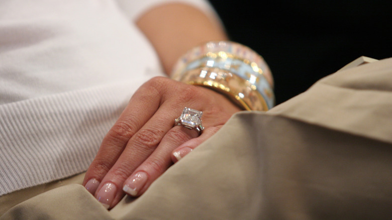 Detail of Melania Trump's engagement ring during her husband Donald Trump's hearing before the Federal Financial Management