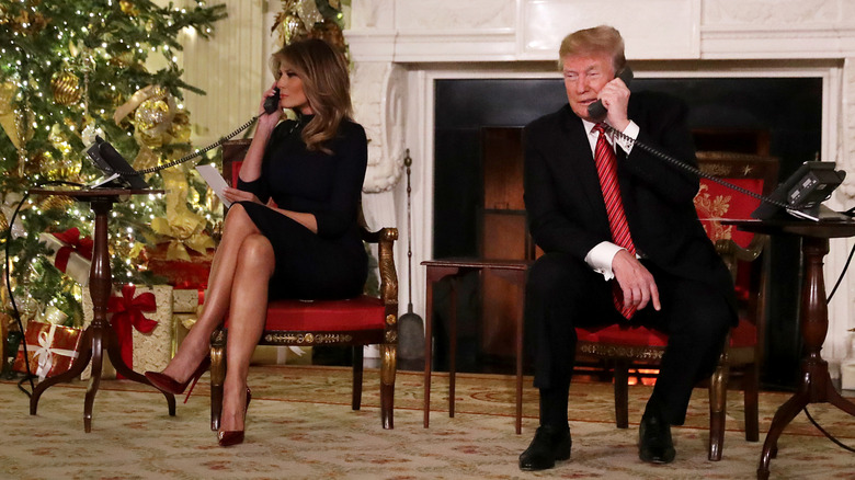 Melania and Donald Trump talking on the phone at the White House