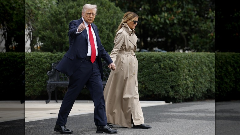 Donald and Melania Trump in England with Melania in a long trench coat