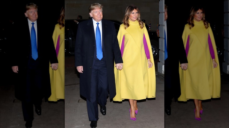 Donald Trump holding hands with Melania Trump in a yellow cape coat