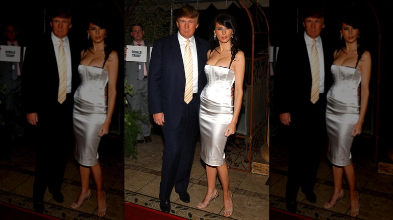 Melania Trump with Donald Trump in a silver dress