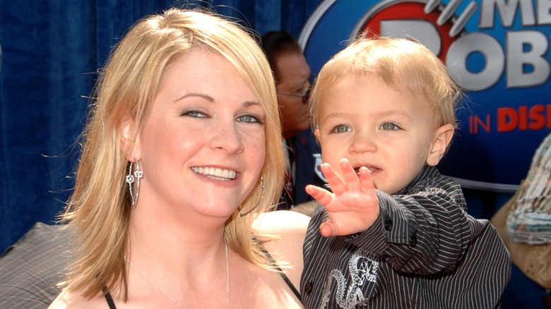 Melissa Joan Hart posing with her son on the red carpet in 2007
