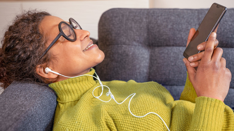 Woman listening to a podcast