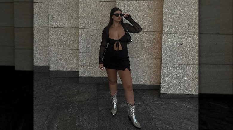 Woman wearing silver cowboy boots