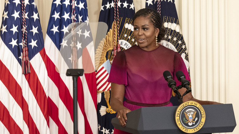 First Lady Michelle Obama and former U.S. President Barack Obama embrace at a ceremony to unveil their official White House portraits at the White House on September 7, 2022 in Washington, DC. The Obama's portraits will be the first official portraits added to the White House Collection since President Obama held an unveiling ceremony for George W. Bush and Laura Bush in 2012. (Photo by Kevin Dietsch/Getty Images)