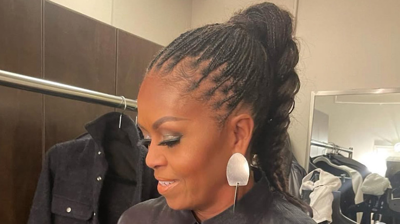 Michelle Obama poses with silver eyeshadow and winged eyeliner