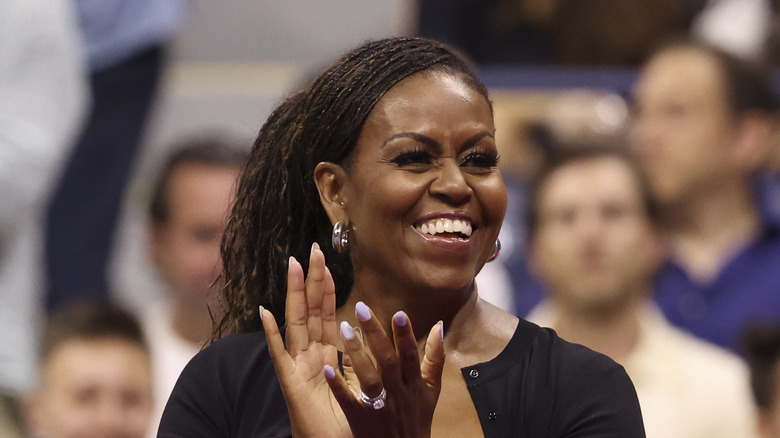 Michelle Obama clapping