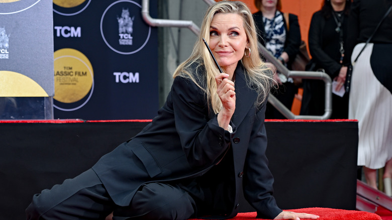Michelle Pfeiffer attends TCM Honors Michelle Pfeiffer With Handprint And Footprint In Cement Ceremony at TCL Chinese Theatre on April 25, 2025