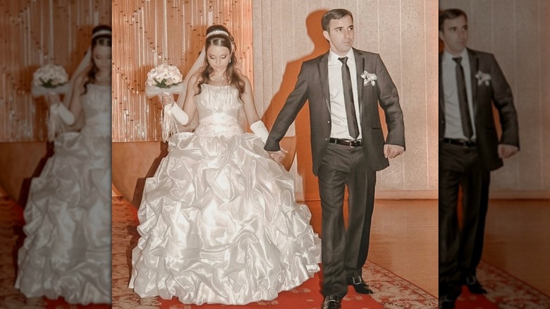 A bride and groom in Russia in 2010 featuring a very poofy wedding dress
