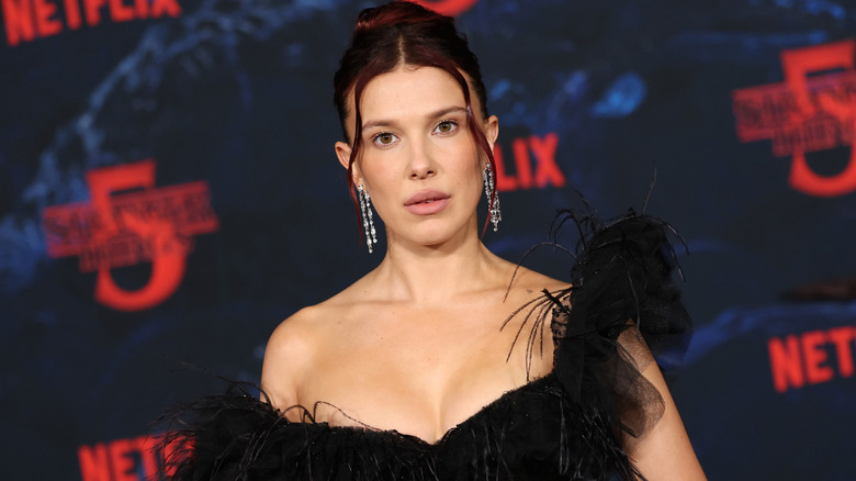 Millie Bobby Brown posing at the LA premiere of "Stranger Things" Season 5