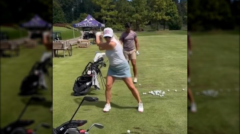 Miranda Lambert playing goflf in a skirt