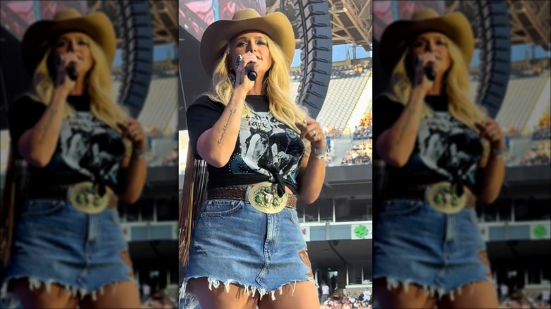 Miranda Lambert performing in a denim skirt