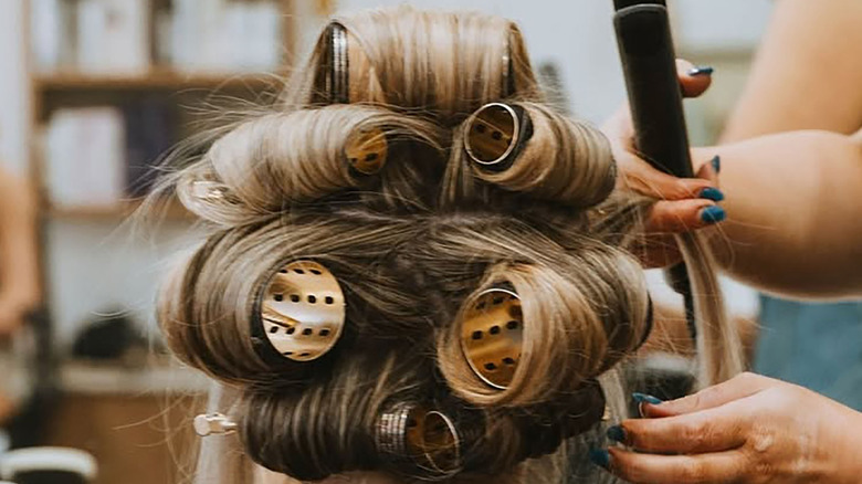 woman with hair rollers
