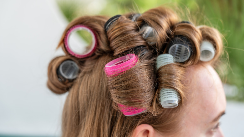 woman with hair rollers