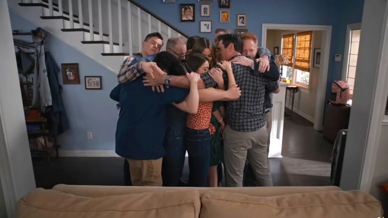 The cast of Modern Family hugging in 2020