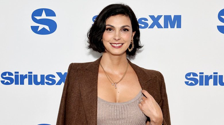 Morena Baccarin smiles on the red carpet in 2024