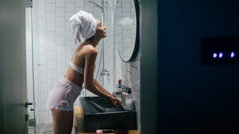 Looking in mirror