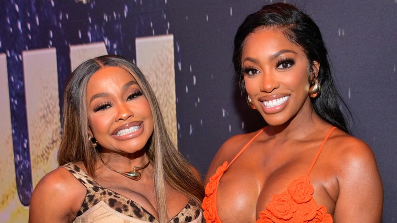 Phaedra Parks and Porsha Williams smiling alongside one another on the red carpet
