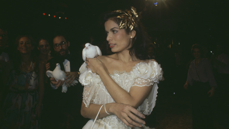 Bianca Jagger with a dove on her shoulder at Studio 54