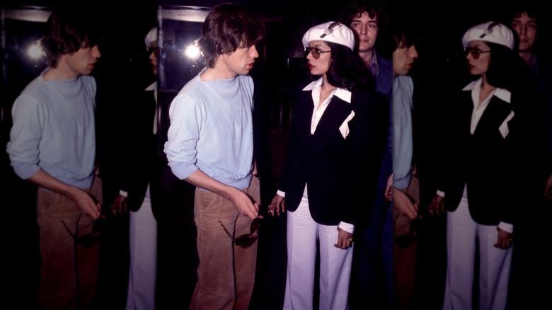 Mick and Bianca Jagger out with a group of people