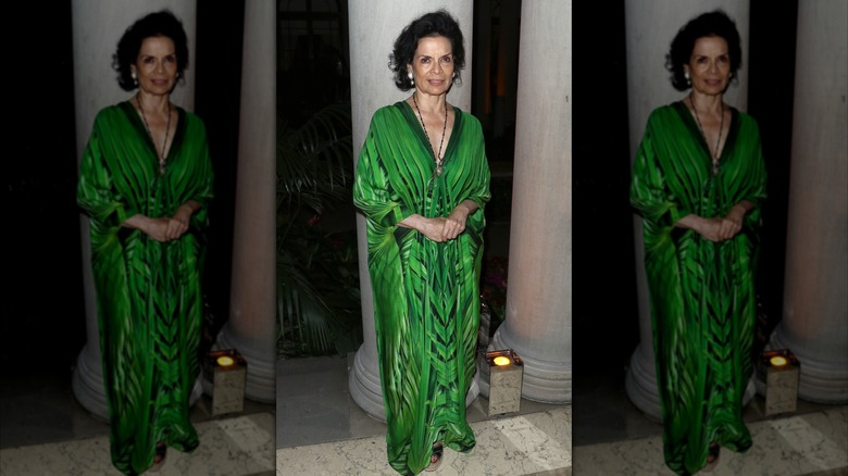 Bianca Jagger in an emerald green kaftan at an event in New York City