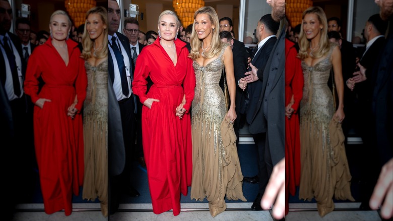 Yolanda and Bella Hadid holding hands while attending an event during the Cannes Film Festival
