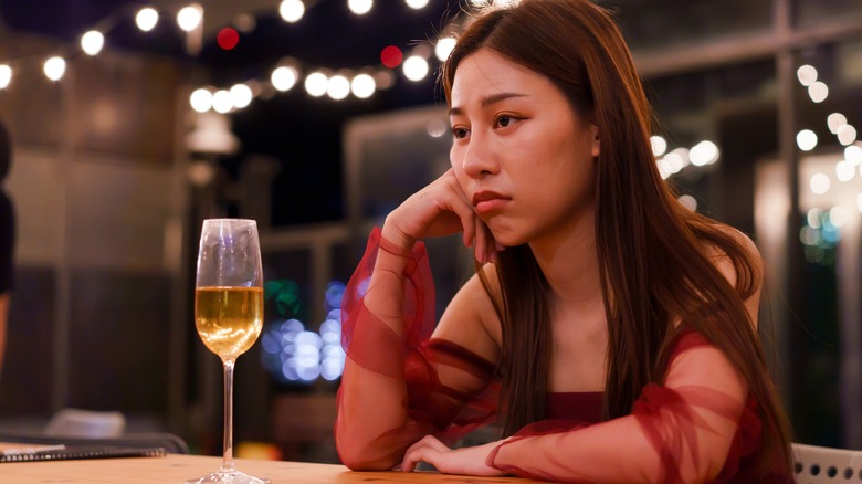 sad woman with wine