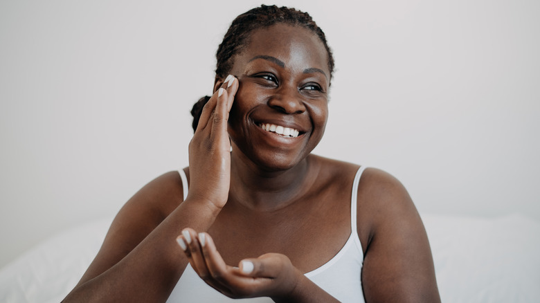 Person using moisturizer