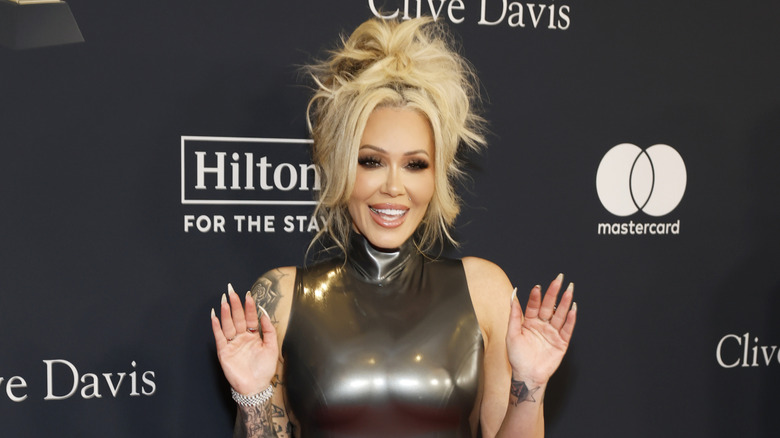 Bunnie Xo on the red carpet in a gunmetal gray dress