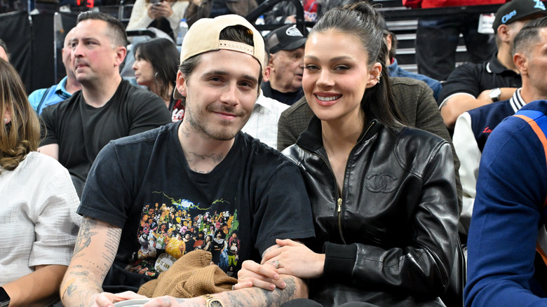 Brooklyn Beckham and Nicola Peltz attend a basketball game on April 24, 2025