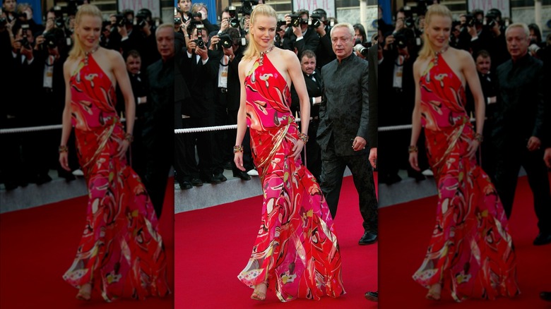 Nicole Kidman in a red, patterned dress on the red carpet in 2003