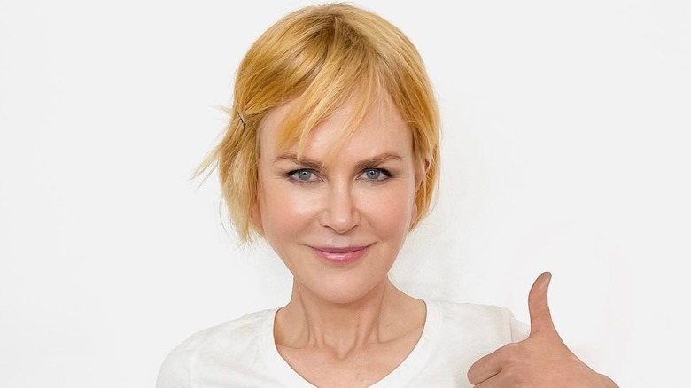 Nicole Kidman wearing a pulled back red wig