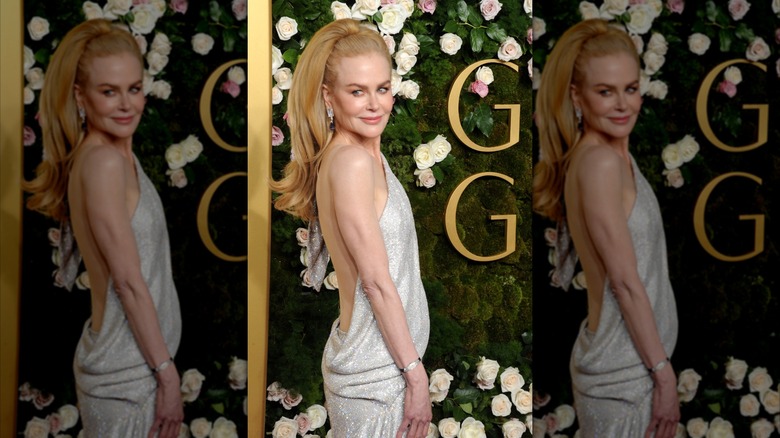 Nicole Kidman on the red carpet in a silver backless dress