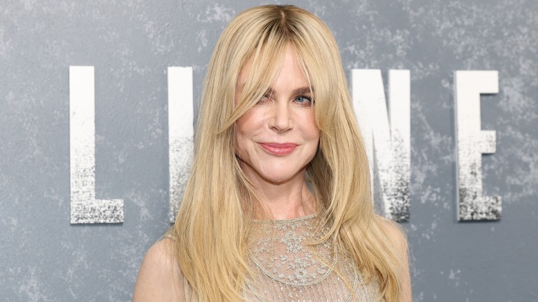 Nicole Kidman smiling with her hair down at an event in 2026