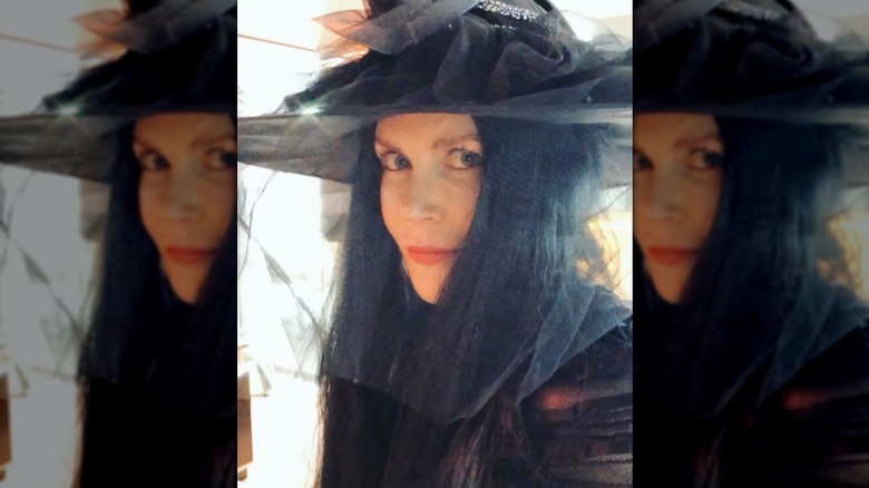 Nicole Kidman wearing a black wig