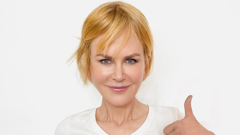 Nicole Kidman wearing a pulled back red wig