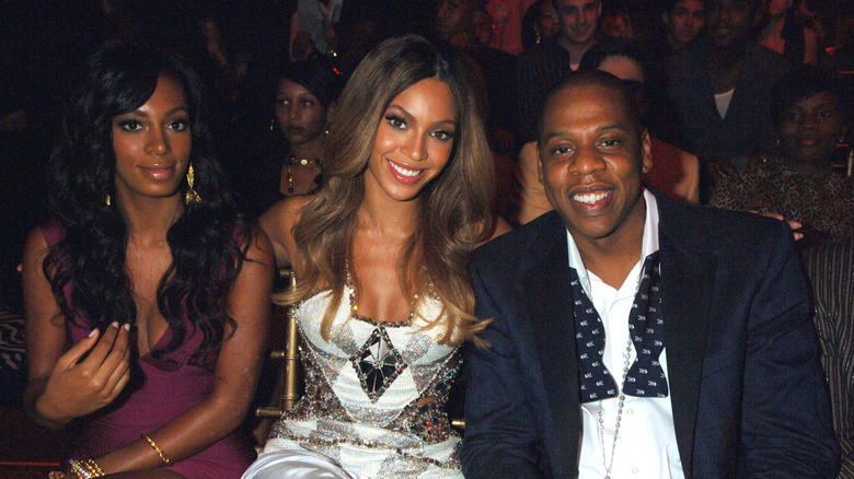 Solange Knowles with Beyoncé and Jay-Z