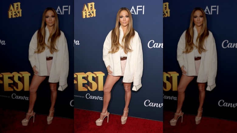 Jennifer Lopez wearing a white shirt with platform T-bar heels