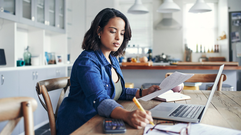 Woman with her computer open 