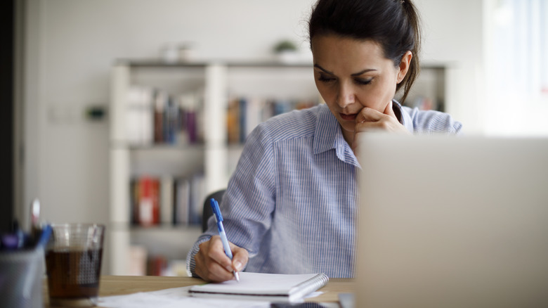 A woman sitting at her desk 