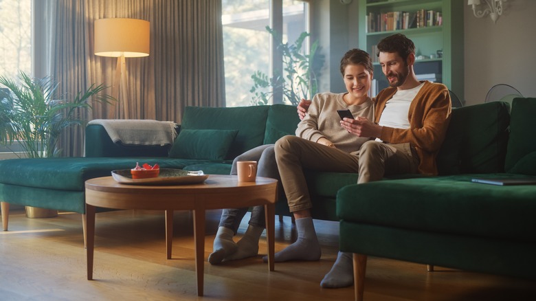 couple cuddling on couch