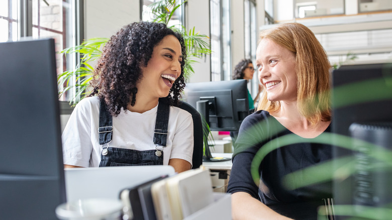 two women happy at work