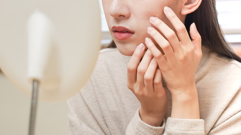 Woman applying cream