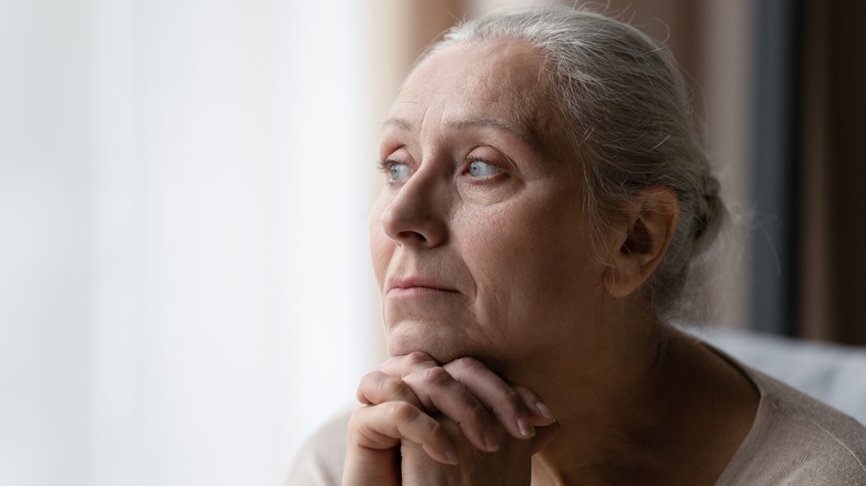 Older woman looking out