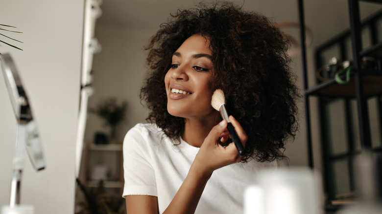 Woman applying powder